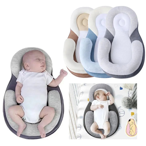 Baby laying in anti rollover pillow with various colors on white background