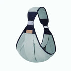 Green  baby carrier on a white background