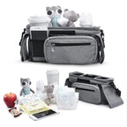 Gray stroller bag with baby items on a white background