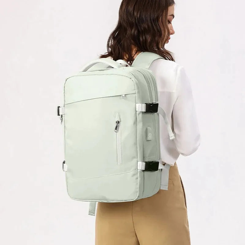 Person wearing a light green backpack on a white background