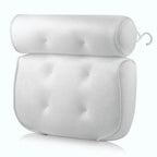 White bath pillow with mesh design on a white background