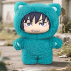 Teal plush toy with character face on a wooden surface outdoors