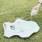 video showing water being poured on dog vest and installing on a happy dog