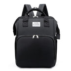 Black multifunction portable diaper backpack with white accents on a white background