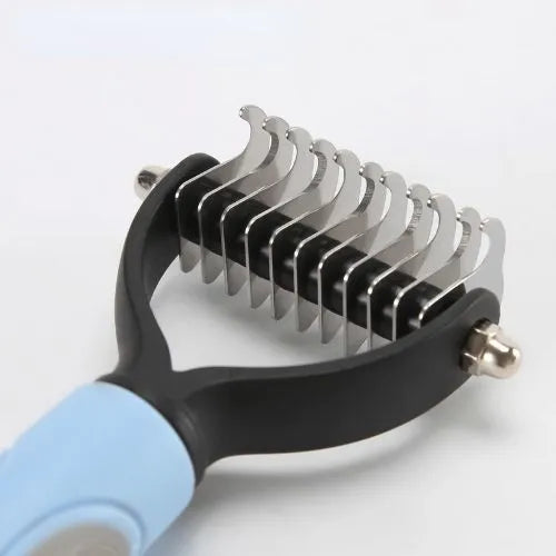 Pet grooming tool with metal blades on a white background