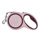 Wine red and pink retractable dog leash on a white background