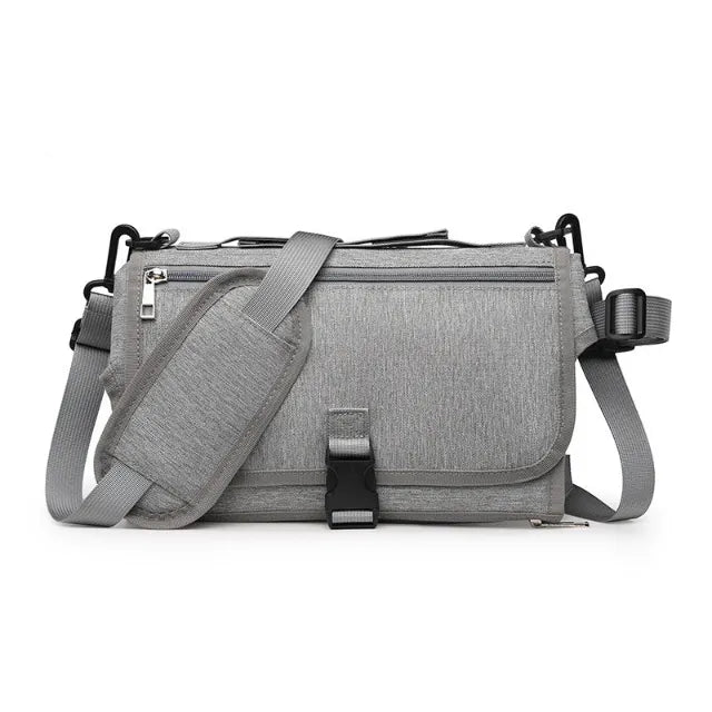 Light gray portable changing pad on white background