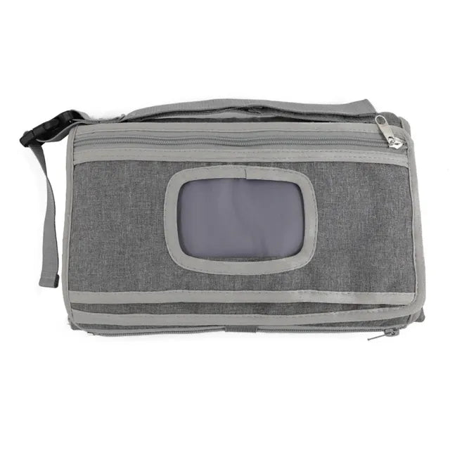 Gray portable changing pad on white background