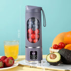 Purple portable blender showing dimensions with fruits and a glass of juice on a light blue background