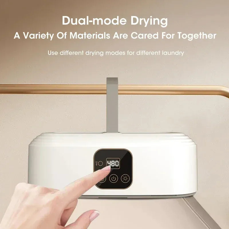White dryer with digital display and hand interacting with it, on a beige background.