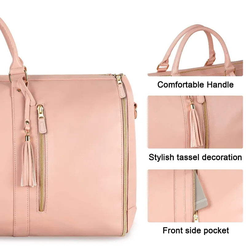 Pink folding suit bag with handles, tassels and front pocket on a white background