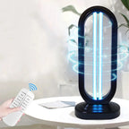 Ultraviolet light sterilizer on a table with a remote control