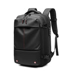 Black vacuum compression backpack with red accents on a white background