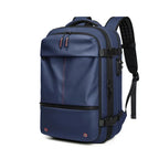 Blue vacuum compression backpack with red accents on a white background