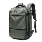 Green vacuum compression backpack with red accents on a white background