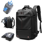 Black vacuum compression backpack with features on a white background
